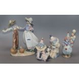 A Lladro group and three clowns