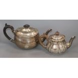 A George V Scottish silver teapot of plain oval form and an Edwardian bachelor's teapot of fluted