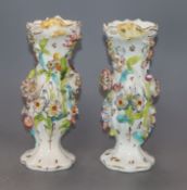 A pair of Victorian floral encrusted porcelain vases height 21cm