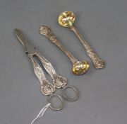 A pair of silver grape shears, Sheffield, 1959 and a pair of Victorian silver mustard spoons.