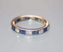 A white metal, sapphire and diamond set full eternity ring, (size alteration), size U/V.
