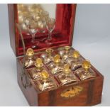 A 19th century inlaid liqueur casket with gilded bottles and glasses