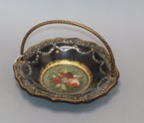 A Victorian papier mache basket, with central floral panel