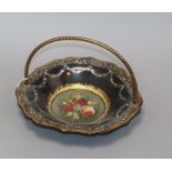 A Victorian papier mache basket, with central floral panel