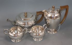 A George VI silver four piece tea set, by C. Eldridge, London, 1940 and a pair of silver sugar