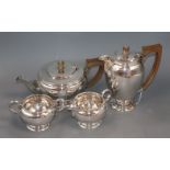 A George VI silver four piece tea set, by C. Eldridge, London, 1940 and a pair of silver sugar