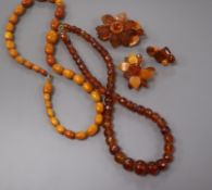 A single strand graduated oval amber bead necklace, gross 22 grams, 44cm, one other amber necklace