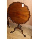 A George III style carved mahogany piecrust tilt-top tea table