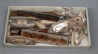 A group of small silver/white metal including, mounted combs, nail buffers, butter knife,