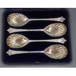 A cased set of four Victorian silver serving spoons, London, 1895 and a cased set of twelve pairs of