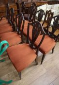 A set of eight Hepplewhite style carved mahogany shield-back dining chairs (two with arms)