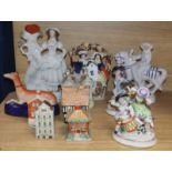 A small collection of Staffordshire figures, groups and cottages, two Sitzendorf figural groups, a