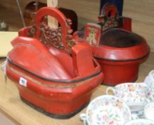 A pair of Oriental red lacquered baskets