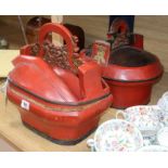 A pair of Oriental red lacquered baskets