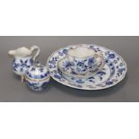 A Meissen blue onion pattern cup, saucer, cream jug, sugar bowl and cover