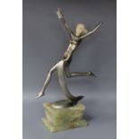 An Art Deco patinated bronze and ivory figure of a dancer by Dakon