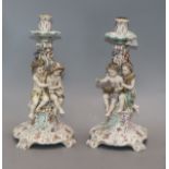 A pair of Rudolstadt Volkstedt porcelain candlesticks, with putti stems height 31cm