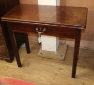 A George III mahogany tea table, with folding top and frieze drawer W.84cm