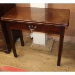 A George III mahogany tea table, with folding top and frieze drawer W.84cm