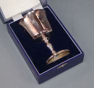 A set of four modern silver wine goblets, individually boxed with presentation inscriptions to the