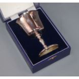 A set of four modern silver wine goblets, individually boxed with presentation inscriptions to the