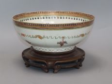 A late 18th century Chinese export polychrome bowl, decorated with a band of ribbon and flowers in