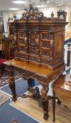 A 17th century style carved walnut cabinet W.105cm