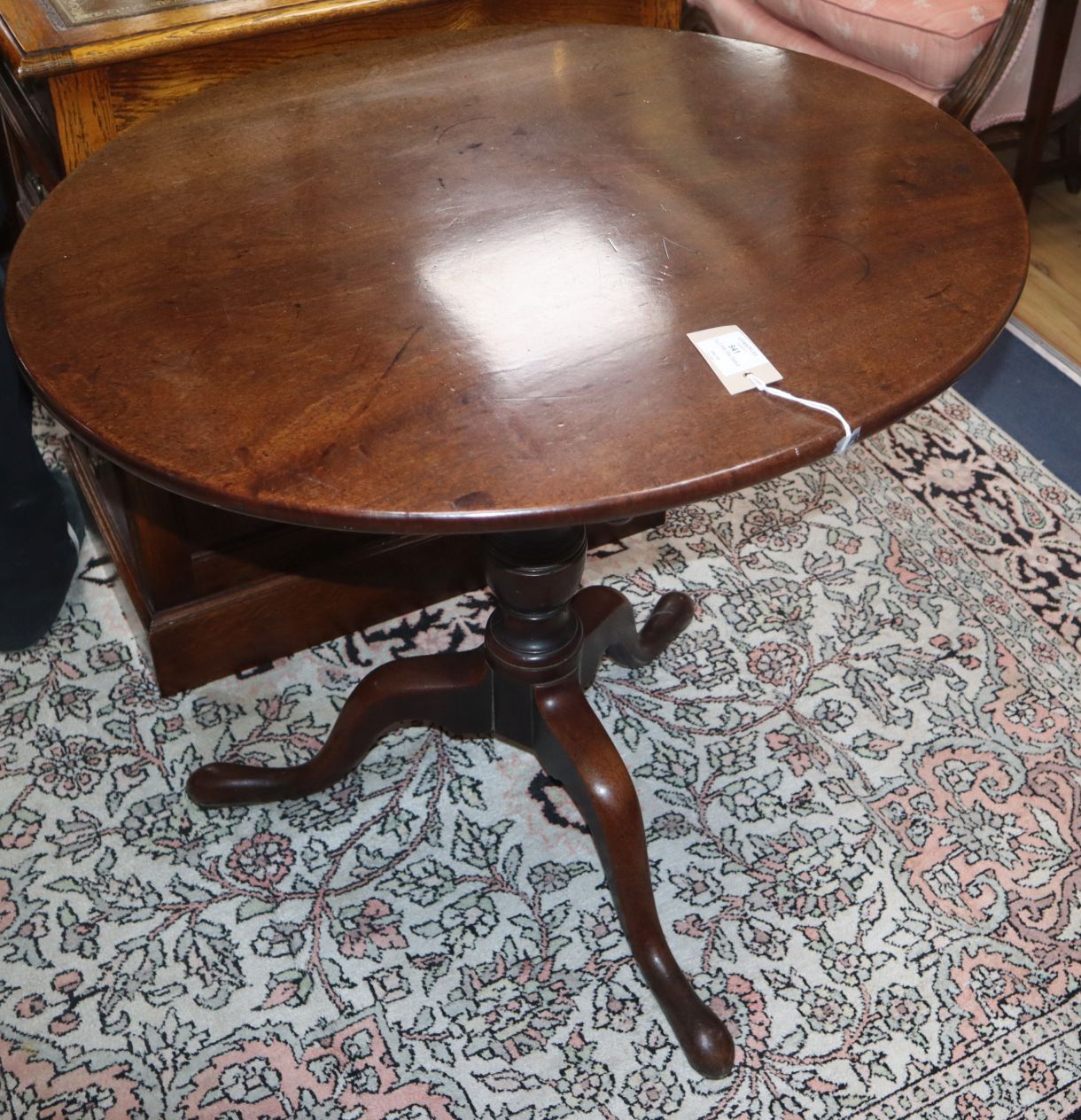 A George III mahogany oval tilt top tea table W.77cm