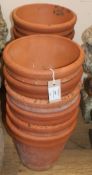 Twelve terracotta garden pots Diameter 24cm