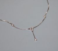 A modern 750 white metal and diamond set drop pendant necklace, approx. 46cm.