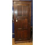 A reproduction oak linenfold hall cupboard W.74cm