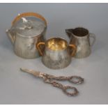 A pair of modern silver grape shears and a silver plated travelling teaset.