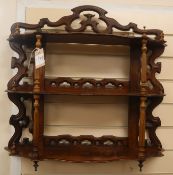 A mahogany three tier wall shelf W.46cm