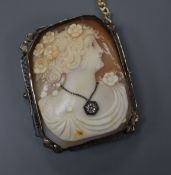 An Edwardian white metal mounted octagonal cameo brooch, carved with the bust of a lady to sinister,