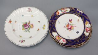 Three mid 19th century floral painted porcelain dessert plates, in the manner of Derby and a set