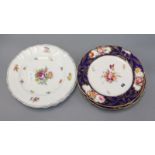 Three mid 19th century floral painted porcelain dessert plates, in the manner of Derby and a set