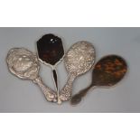 Four assorted silver/white metal mounted hand mirrors including Edwardian.