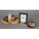 A quantity of mixed silver including a modern pair of rabbit bookends, a mounted timepiece, sugar