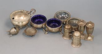 An Edwardian silver mustard, two pairs of silver pepperettes and sundry condiments.