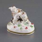 A Staffordshire porcelain group of two kittens playing, c.1835-50, on an oval base encrusted with