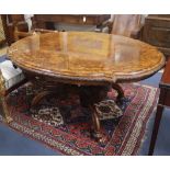 A Victorian oval figured walnut centre table L.150cm