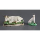 A Davenport porcelain figure of a recumbent cow, c.1830-50, together with a porcelain figure of