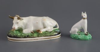 A Davenport porcelain figure of a recumbent cow, c.1830-50, together with a porcelain figure of