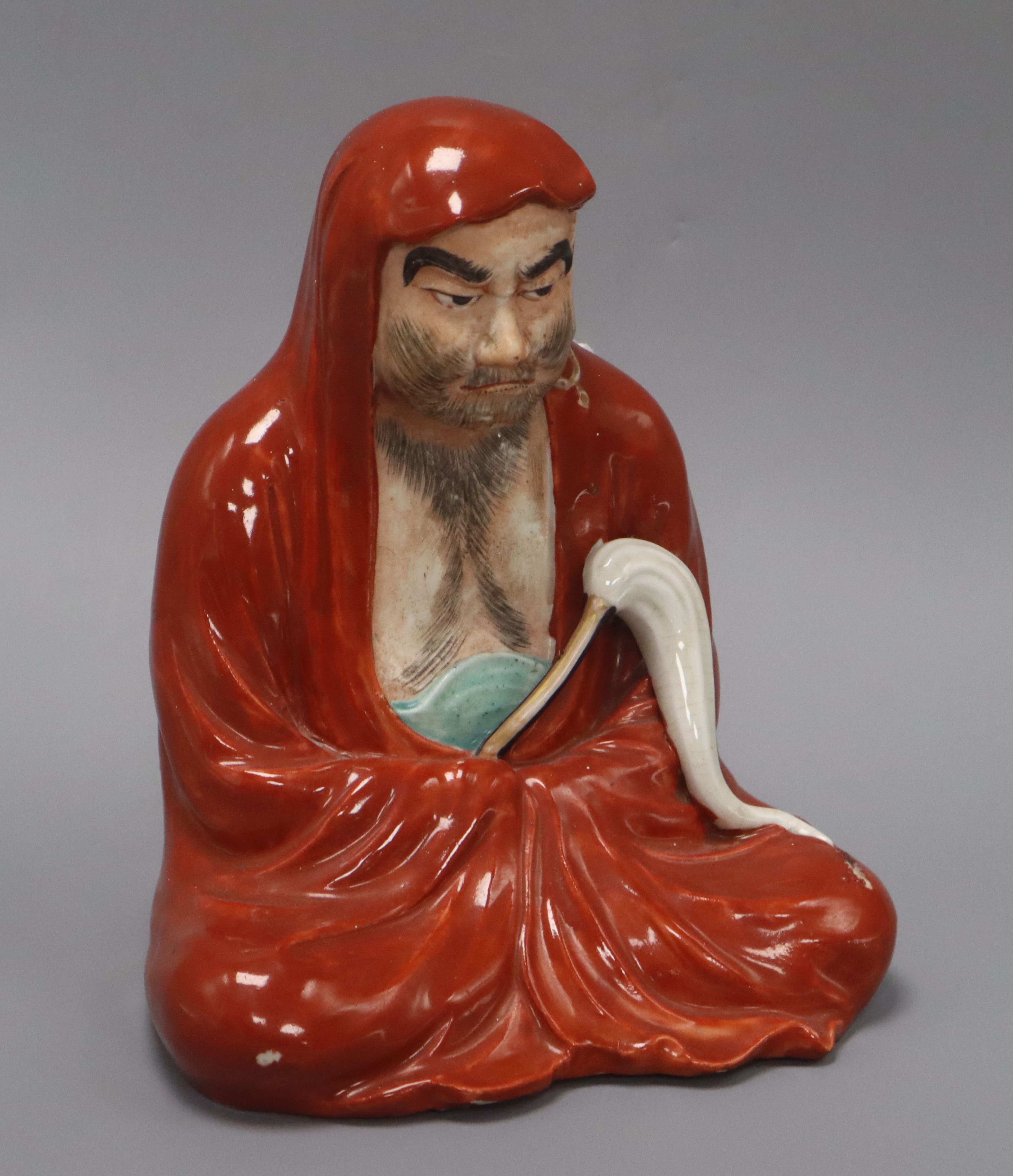 A Japanese kutani figure of a seated rakkan height 21cm