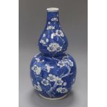 A 19th century Chinese blue and white double gourd vase, Kangxi mark height 33cm
