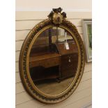 A 19th century French giltwood and gesso oval wall mirror H.100cm