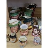 A collection of pottery character jugs