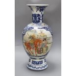 A Chinese blue and white baluster vase, with a polychrome painted panel height 47cm
