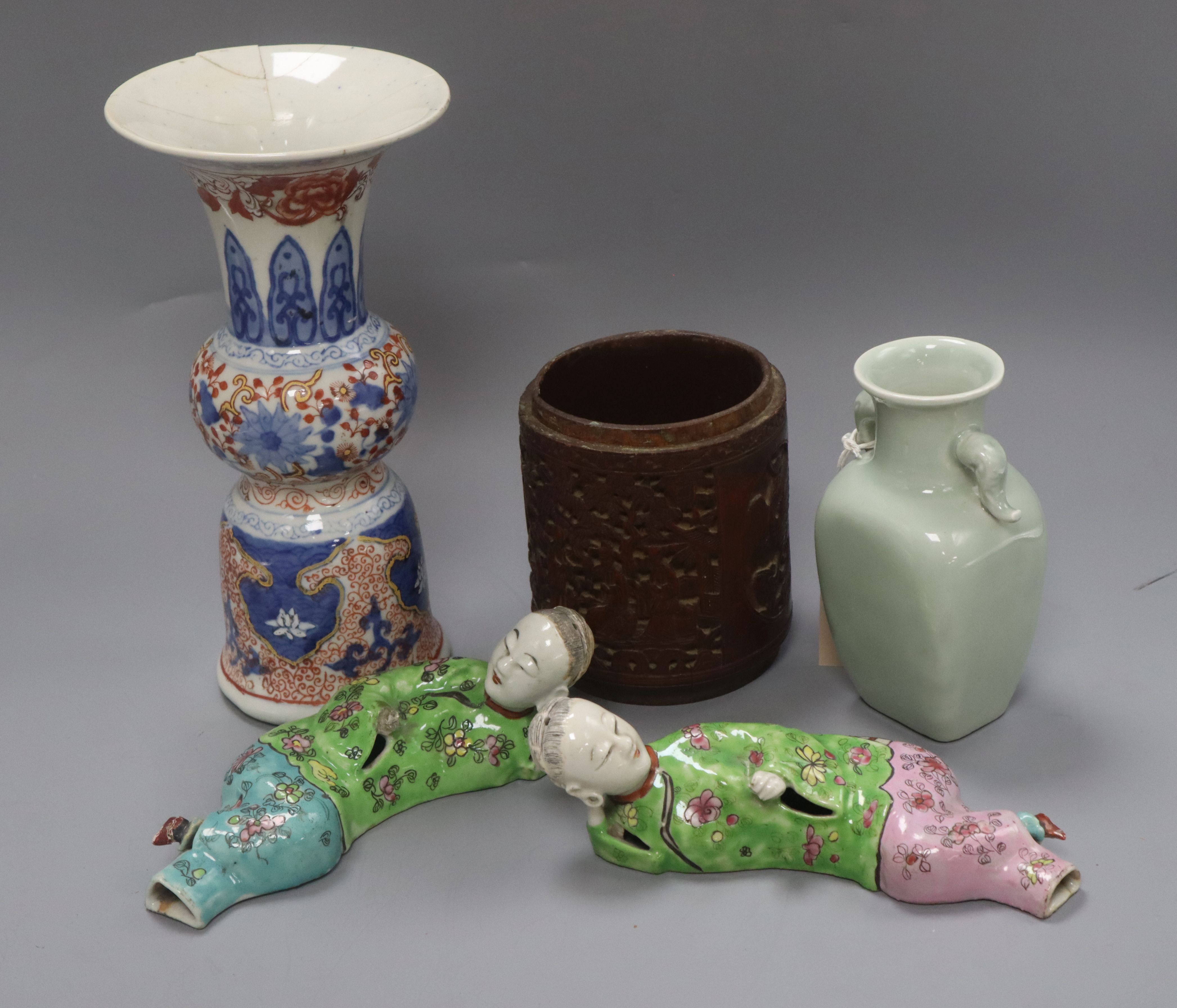 A Chinese celadon glazed vase, a carved wood brush pot, an Imari style vase, etc.