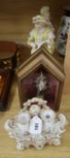 A French porcelain inkstand and a pair of bisque figures and another cased figure.